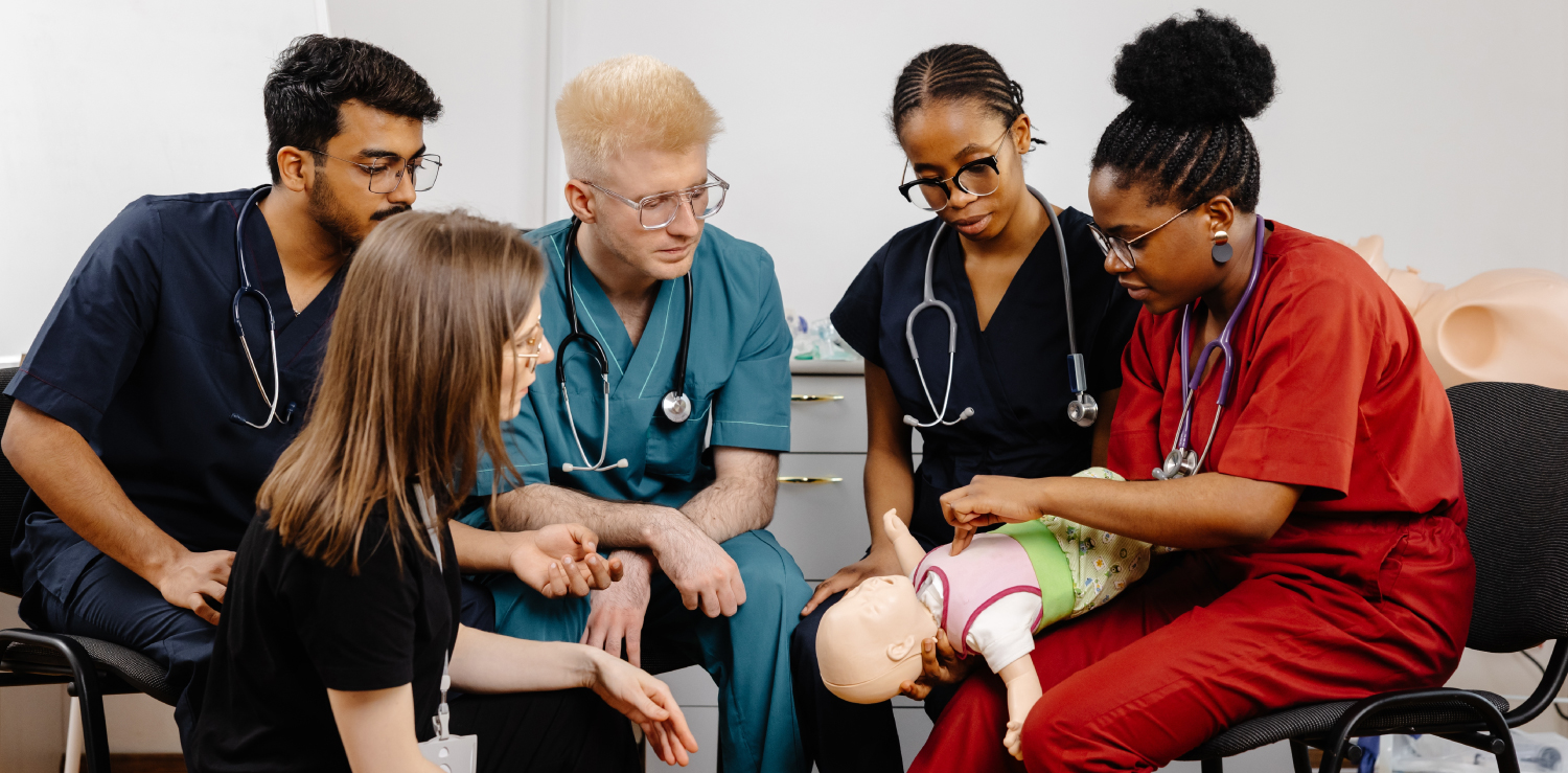 Pediatric Advanced Life Support (PALS) Medical professionals learning the importance of pediatric advanced life support (PALS) by practicing on an infant mannequin.